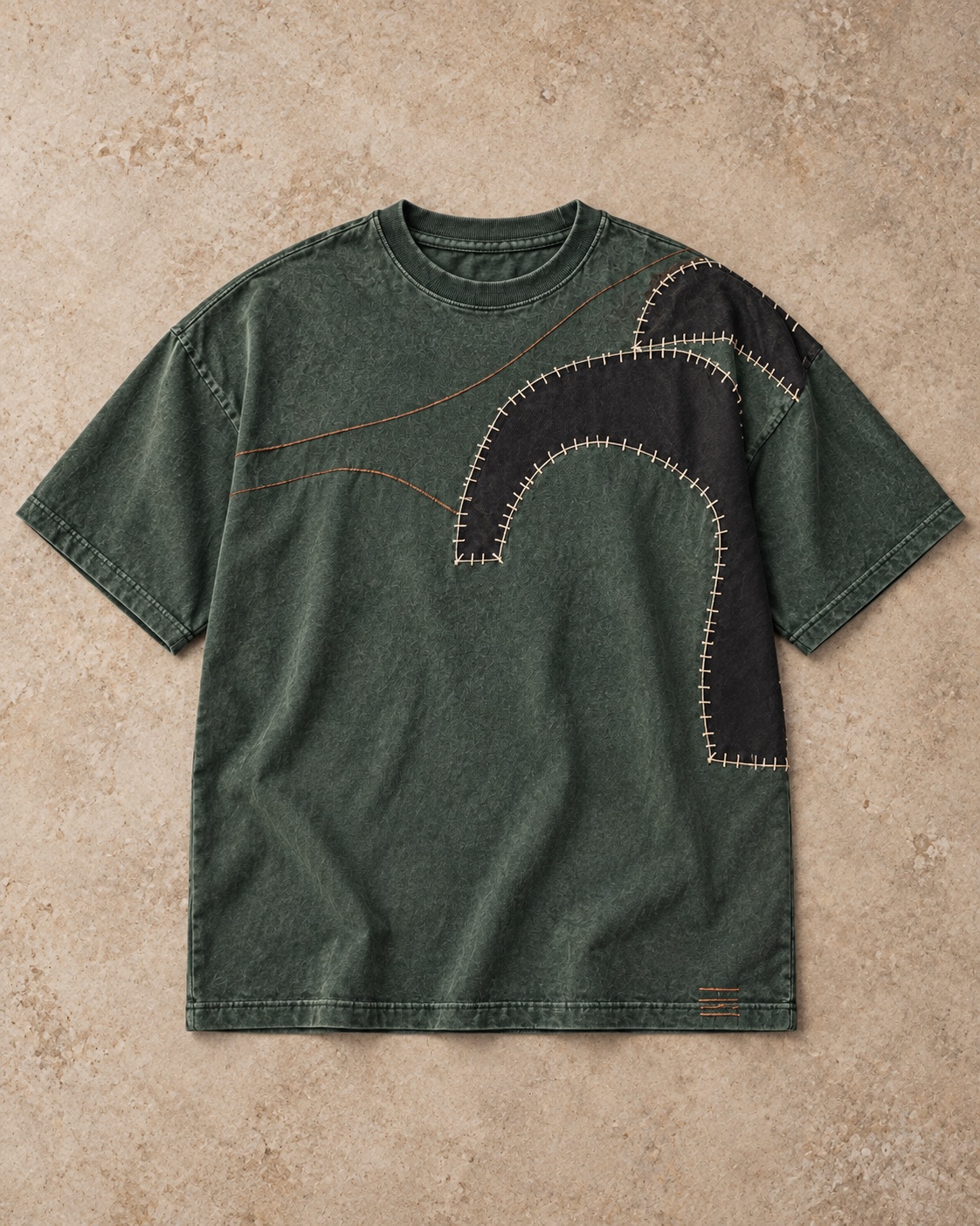 Full garment flat-lay of the original appliqué embroidery t-shirt concept in forest / charcoal / copper