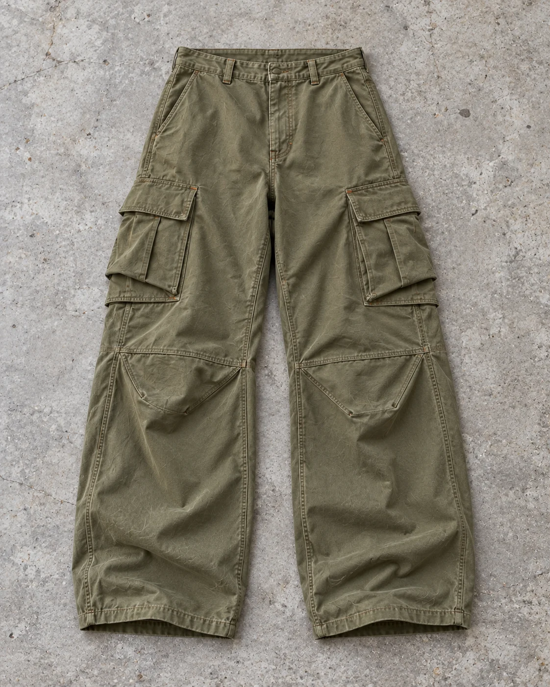 Full garment flat-lay showing the cut — Baggy Cargo Pants in washed olive / rust, AI-generated design concept
