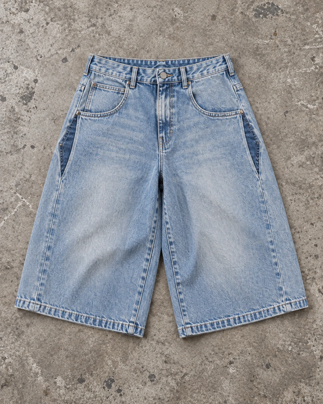 Full garment flat-lay showing the cut — Baggy Denim Shorts / Jorts in faded light blue / indigo, AI-generated design concept