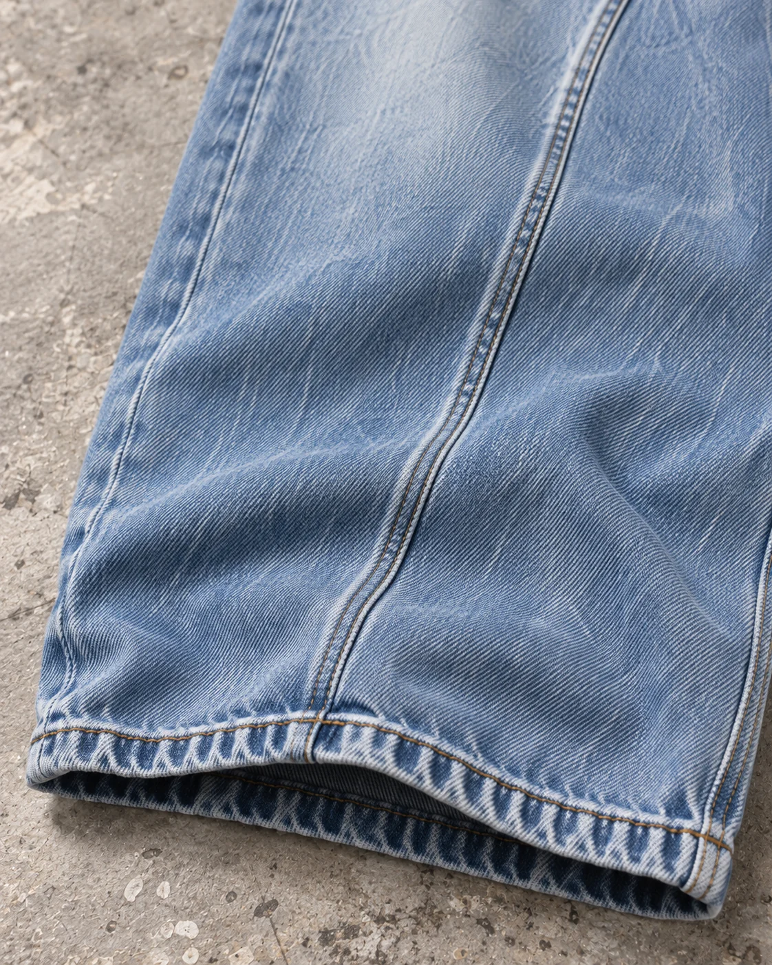 Close-up of fabric and signature construction — Baggy Wide-Leg Jeans in ice blue / faded indigo, AI-generated design concept