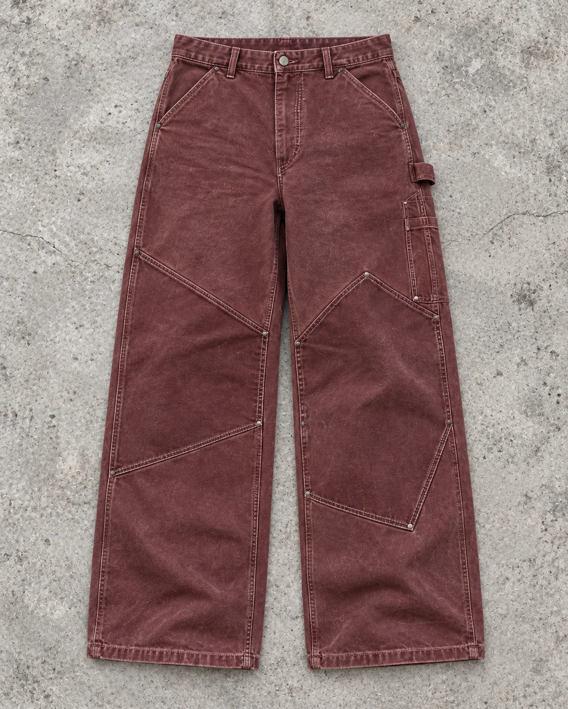 Full garment flat-lay showing the cut — Canvas Carpenter Pants in faded oxblood / chalk, AI-generated design concept
