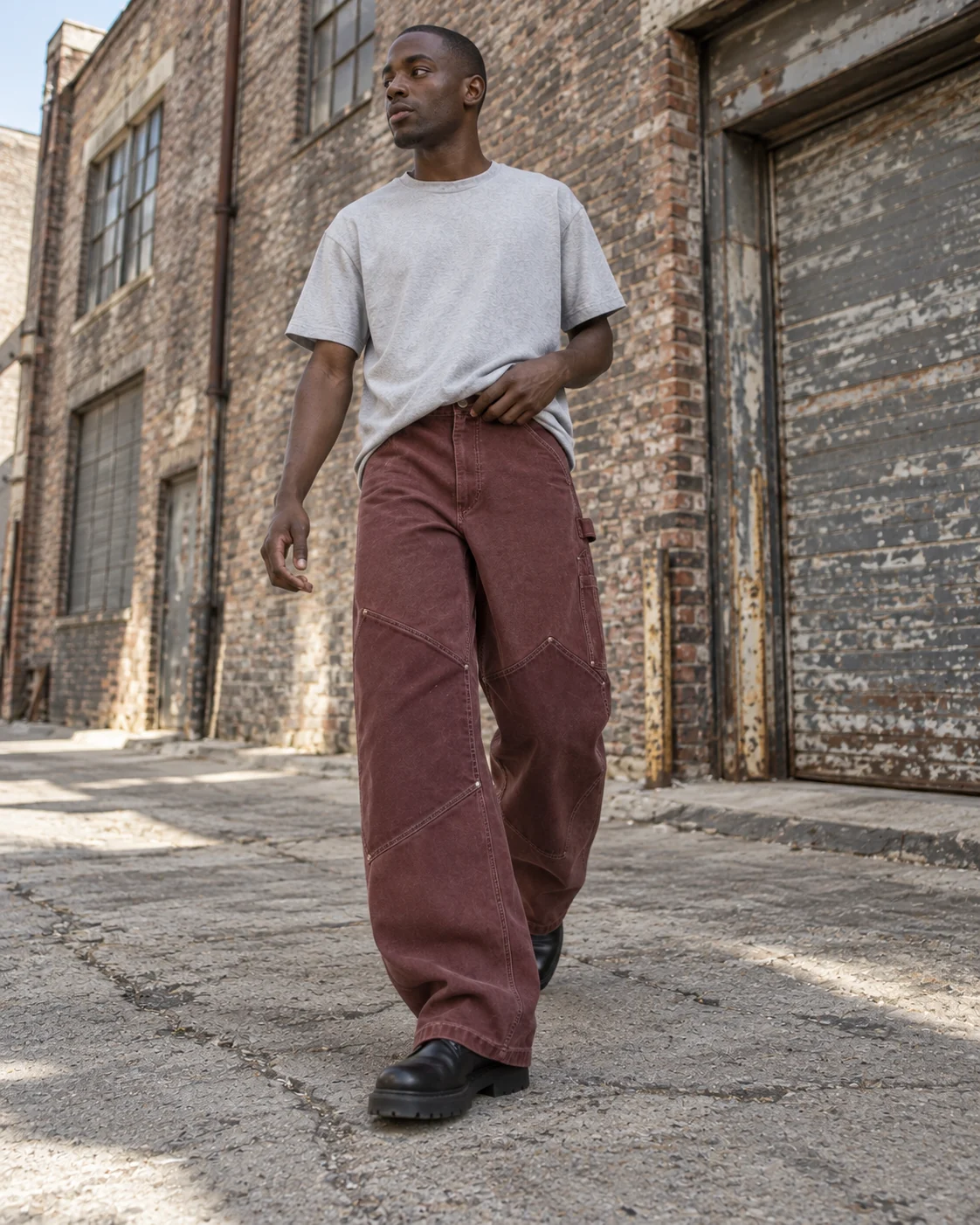 Full-body streetwear styling — Canvas Carpenter Pants in faded oxblood / chalk, AI-generated design concept