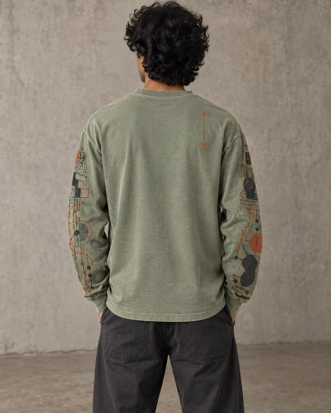 Back on-model view of the original long-sleeve sleeve-print t-shirt concept in mineral sage / burnt orange