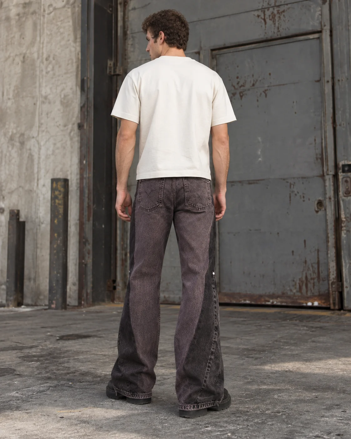 Distinct back design on the same model — Relaxed Flared Jeans in faded plum black / charcoal, AI-generated design concept