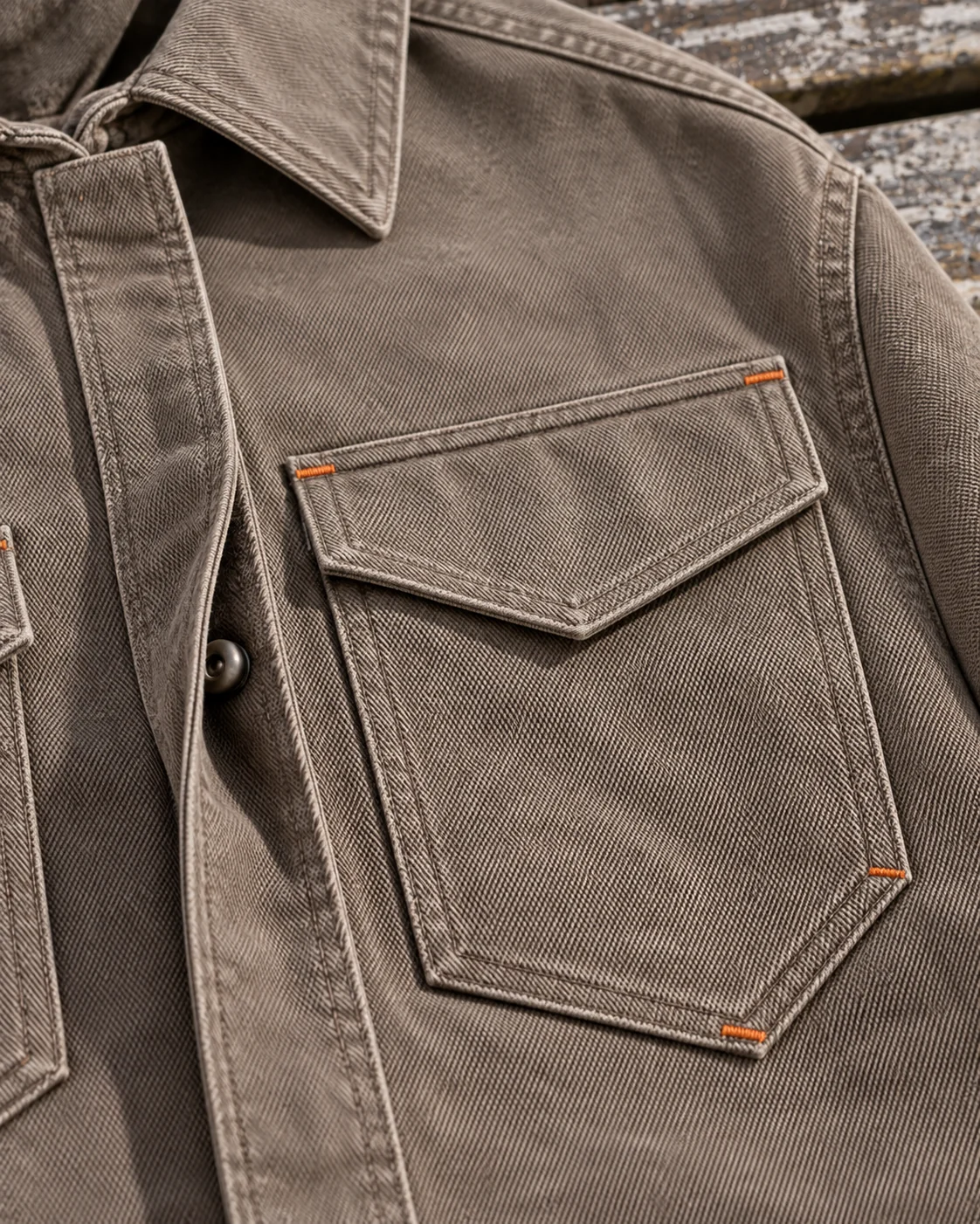 Close-up of fabric and signature construction — Utility Overshirt in warm taupe / rust, AI-generated design concept
