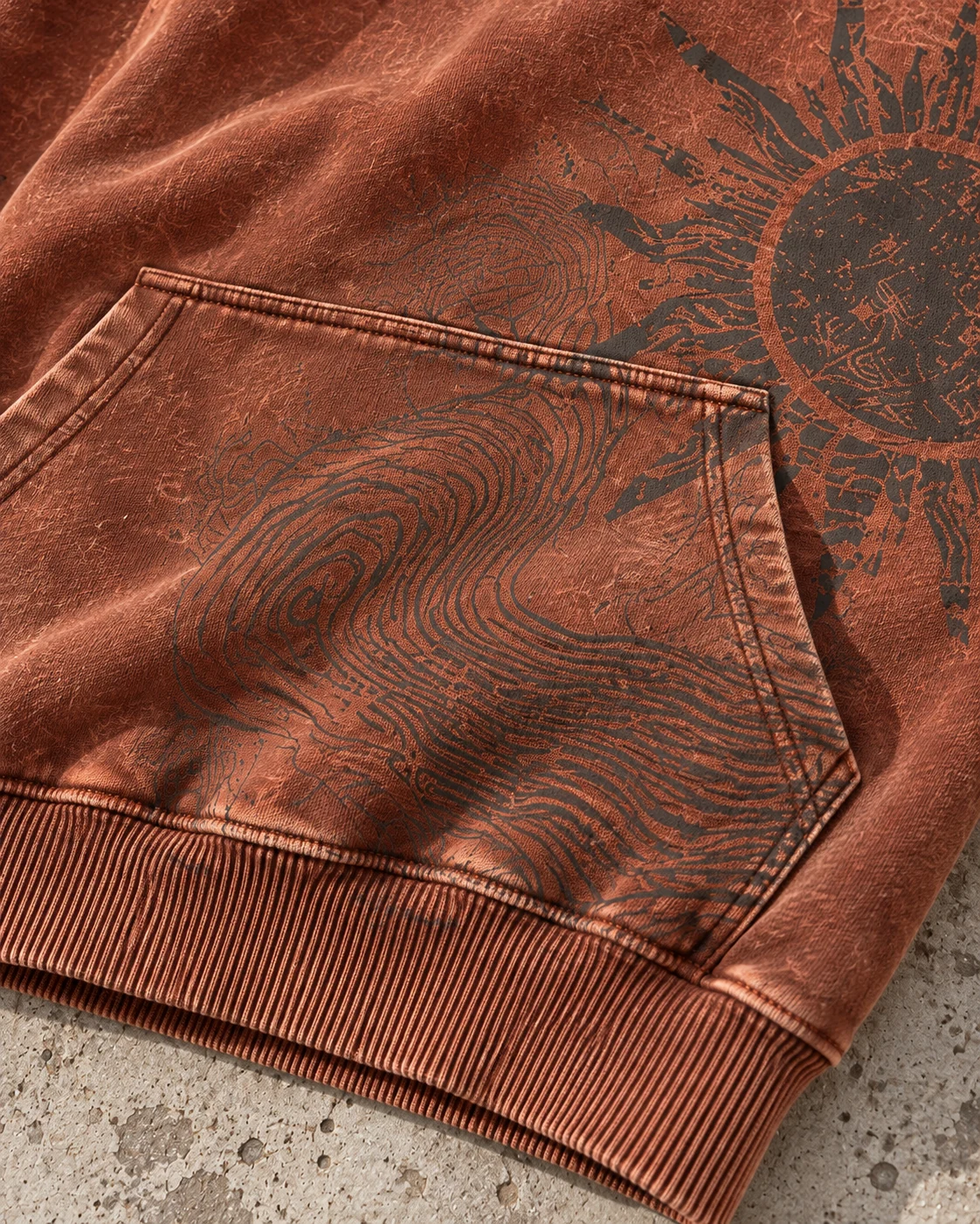 Close-up of fabric and signature construction — Vintage Wash Hoodie in faded rust / charcoal / cream, AI-generated design concept